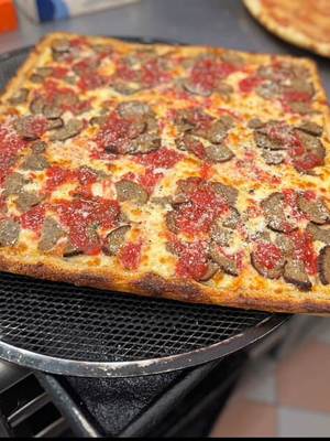 Square Sicilian pie fresh off the peel